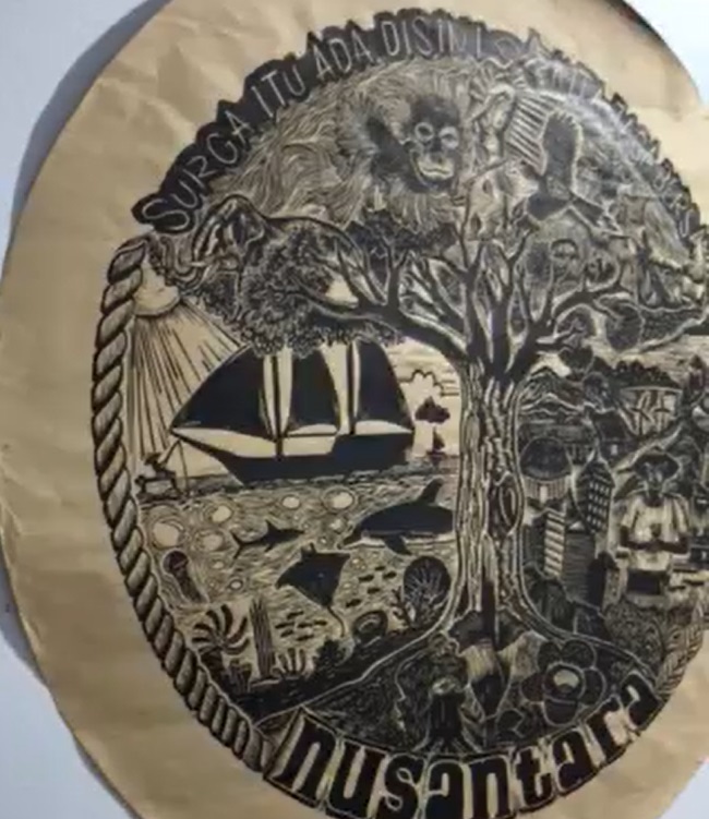 Cropped Bersama block art print with dolphin and nature related images, the artwork has an environmental message